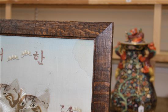 An early 20th century Japanese silkwork panel of two kittens, mounted as an oak firescreen, panel 40 x 43cm
